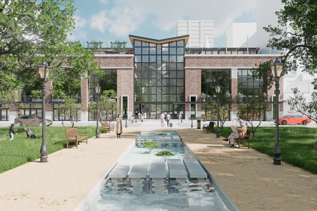 Un bâtiment moderne à la façade vitrée et aux touches de briques fait face à un parc paysager. Un plan d'eau coule au centre, entouré de bancs, d'arbres et de passants assis sur les sentiers sous un ciel partiellement nuageux.